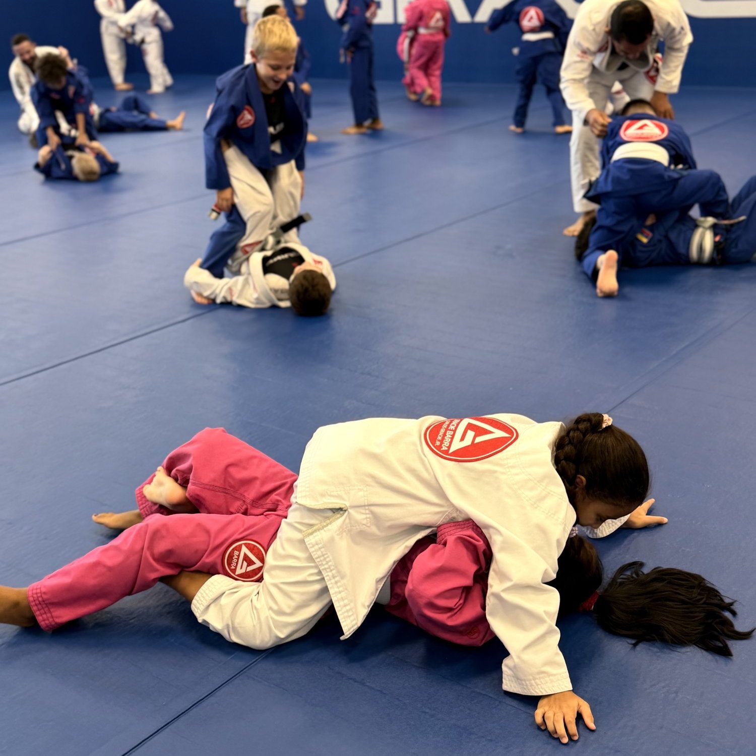 Kids training Brazilian Jiu-Jitsu at Gracie Barra Davenport